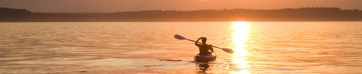 Lone kayaker at sunset